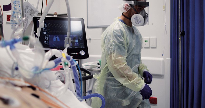 A frontline healthcare worker in PPE at work