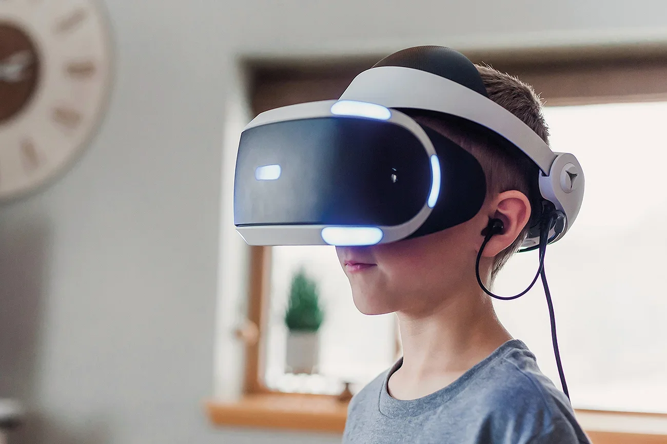 A child wearing a VR headset in a living room