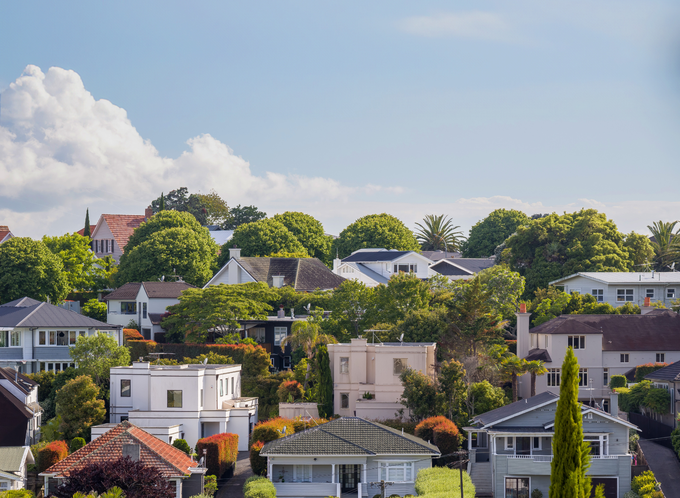 A suburban view showing multiple houses and blue skies listing.png