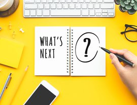 Business inspiration concepts with woman writing What's next? text on notepad