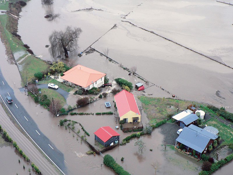 Floodwaters surround farmhouses
