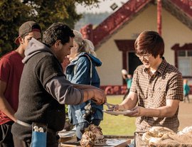 Group serving up a meal embodying manaakitanga or hospitality