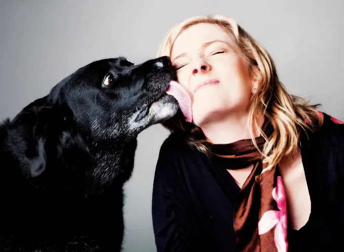 Megan Alderson gets a lick from a happy dog