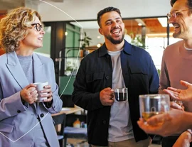 Some colleagues talking in an office with tea  - listing