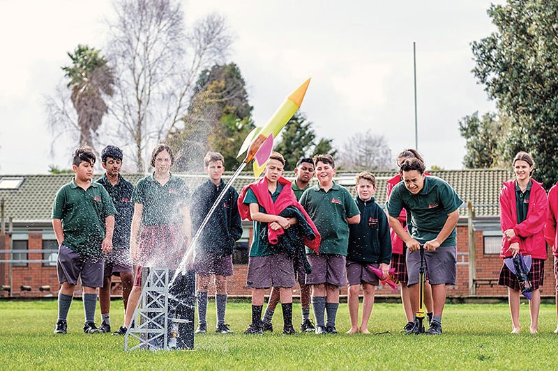 Students at Conifer Grove School setting off a rocket