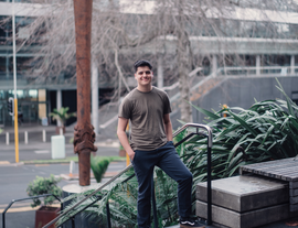 Tom Tamaira Standing on a step in central Wellington lisiting.png