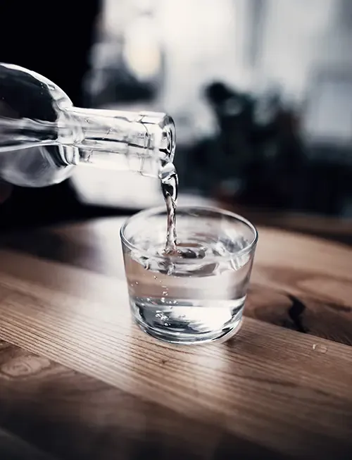 Water being poured into a clear glass