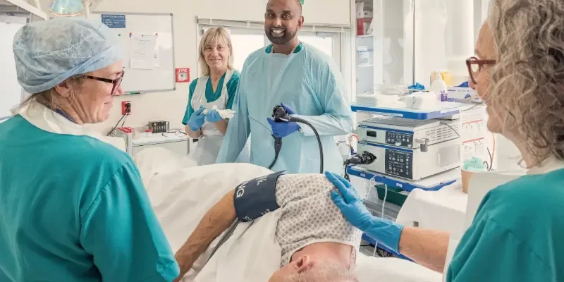 christchurch charity hospital workers tend to a patient