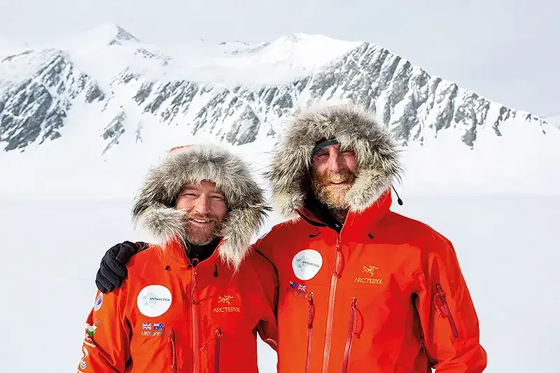 gareth and richard posing on a mountain - ends of the earth.webp