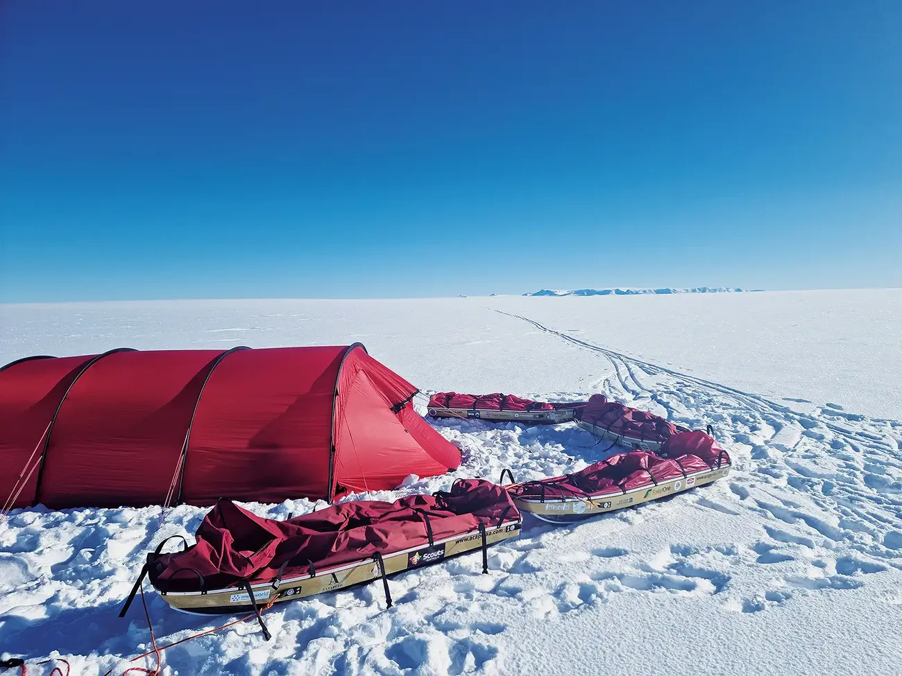tent on a snowy mountain - ends of the earth.webp